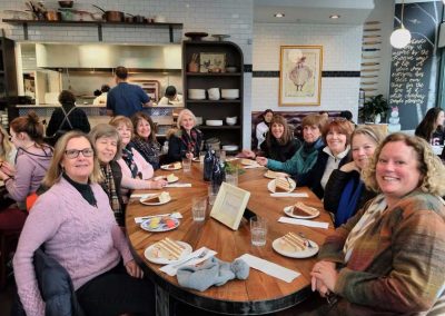 Group of tourists with their cakes served in one of the famous restaurants in Providence, RI.