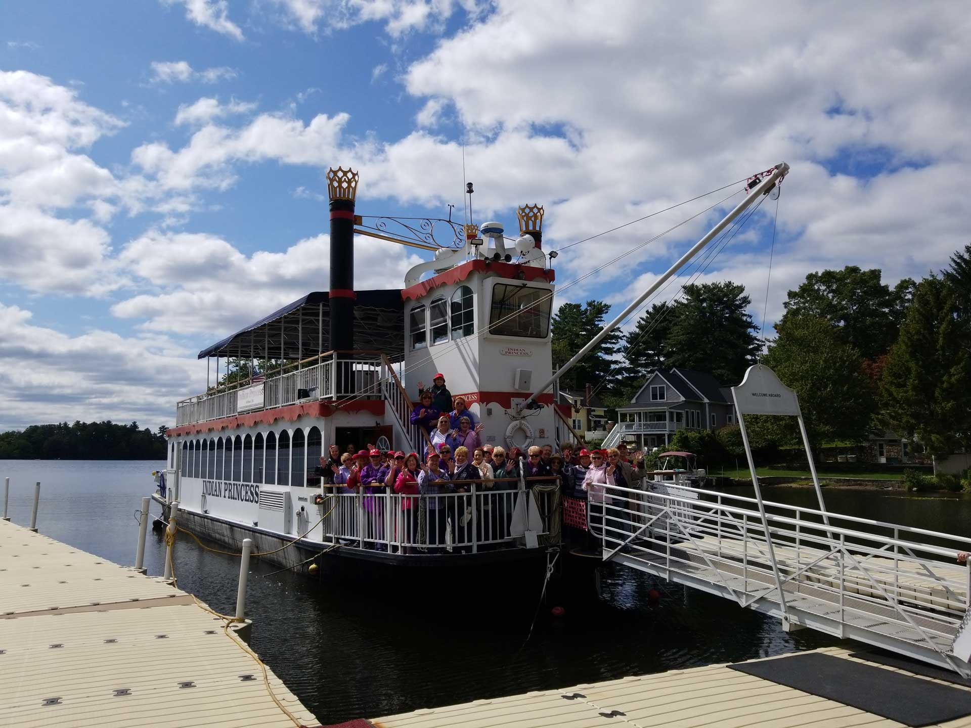 Group of people aboard the Indian Ranch Princess Cruise docked at the port at Webster Lake, Massachusetts.