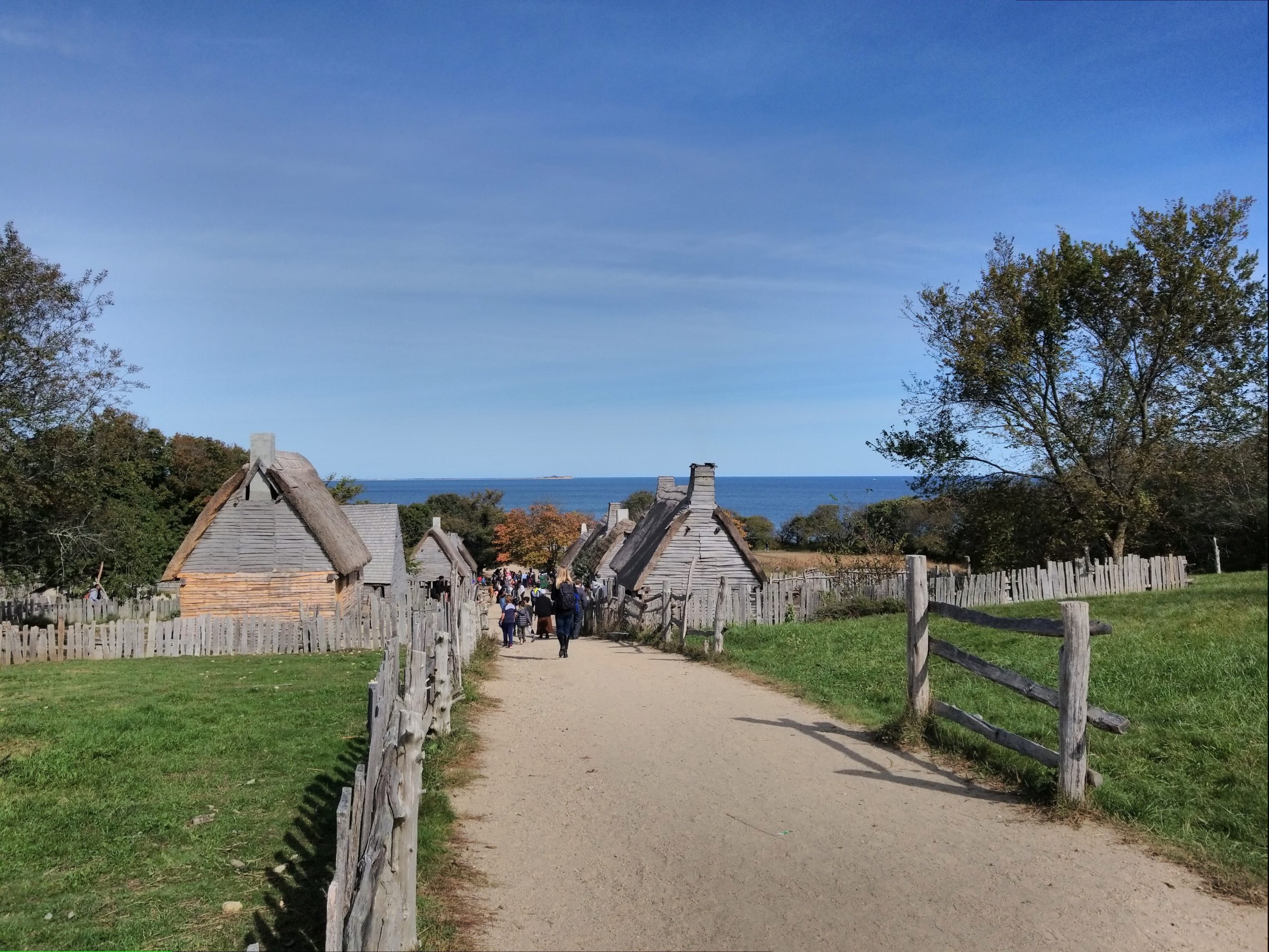 Visitors entering the Pilgrim Village - a view included in the Plimoth Plantation & Cranberry Harvest Tour.