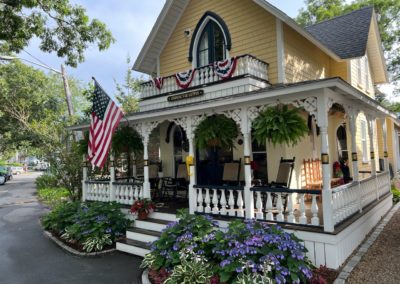 View of brightly painted Gingerbread Houses of Oak Bluffs - a destination included in the A Day on Martha's Vineyard Tour.