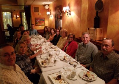 Tourists enjoying a delicious Meal in an Italian Restaurant - an experience included in the An Evening in the City Tour.