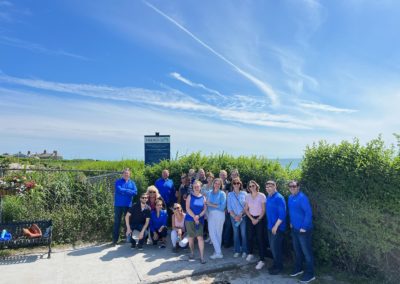 Group of tourist posing at one of the many pit stops in the Cliff Walk Trail