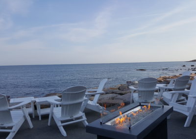 Benches near the shore for the best seaside sunset experience - included in the Coast Guard House & Sunset Sail Tour.