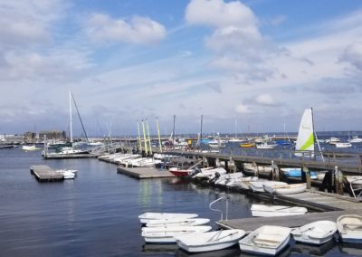 View of bot docked at the harbor inside Sakonnet Point Club - included in the Come Away to the Quiet Coast Toar.