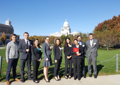 Group picture of students with the view of the Rhode Island State House - included in the Discover Providence Tour