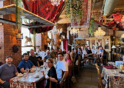 Group of tourists enjoying their coffee at the CAV Restaurant in Providence - included in the Journey Through the Arts Tour.