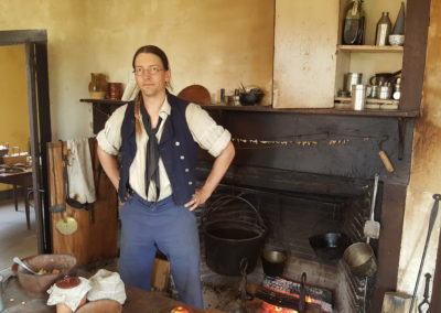 A guy having breakfast in a barn house in Coggeshall Farm Museum, Bristol, RI - included in the Life by the Bay Tour.