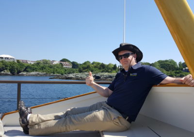 View of the The Ocean Cliff on a sailboat - an experience included in the Newport Sail & Lunch at Sweet Berry Farm Tour.