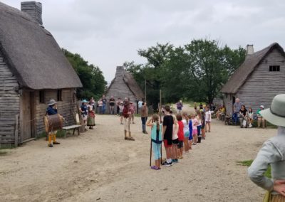 View of cottages inside Plimoth Patuxet Museums - a destination included in the Plimoth Plantation & Cranberry Harvest Tour.