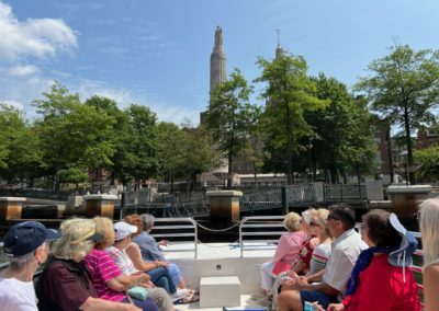 View of the Providence Pedestrian Bridge by boat along theRiver - included in the Providence by Road and by River Tour.