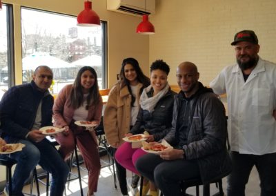 Tourists enjoying a lunch at an Italian Restaurant - an experience included in the Providences Very Delicious Lunch Tour