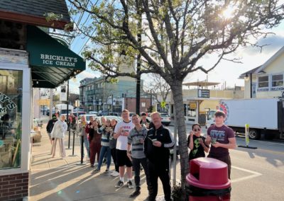 Group picture of tourists eating their ice cream at Brickley's Ice Cream - included in the Scenic Rhode Island Tour.