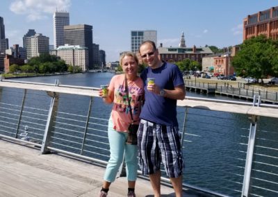 Couple standing at the Providence Pedestrian Bridge, taken during the Taste of Rhode Island Tour.