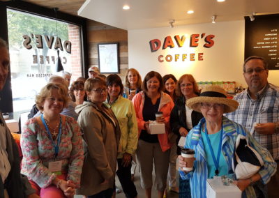 Group picture inside the famous Dave's Coffee Shop - a destination included in the Taste of Rhode Island Tour.