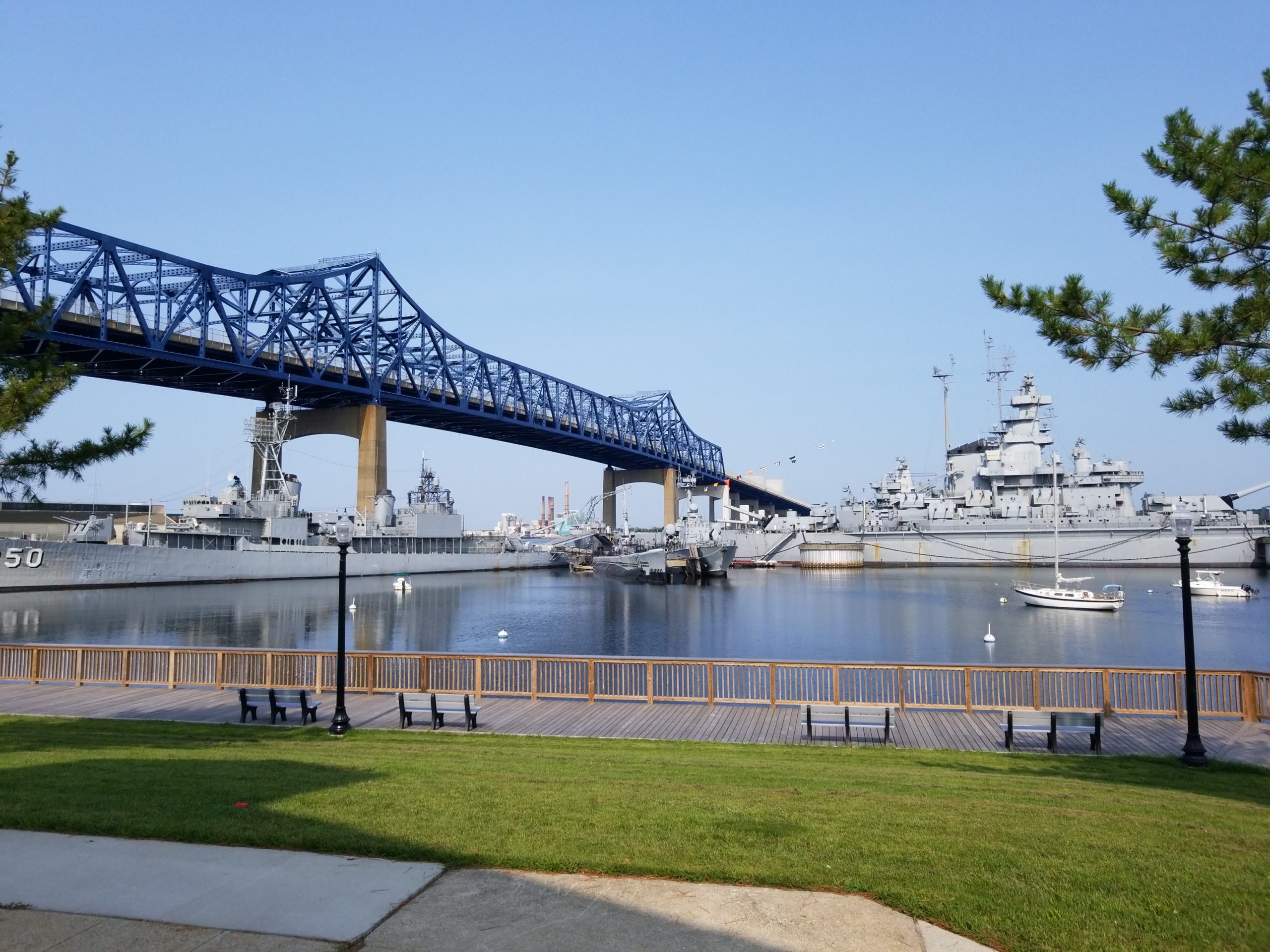 View of the Braga Bridge and USS Massachusetts docked at the Battleship Cove, Fall River, MA. - a destination included in the A Military Experience Tour.