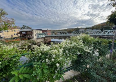 View of the Bridge of Flowers which spans the Deerfield River - a destination included in Beauty of the Berkshires Tour.